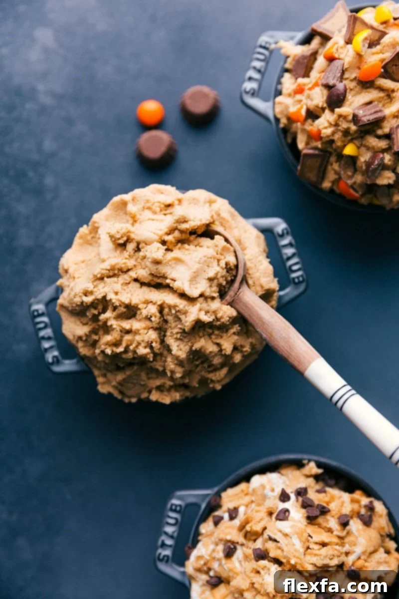Bowl of creamy peanut butter cookie dough dessert accompanied by a spoon, ready for serving.