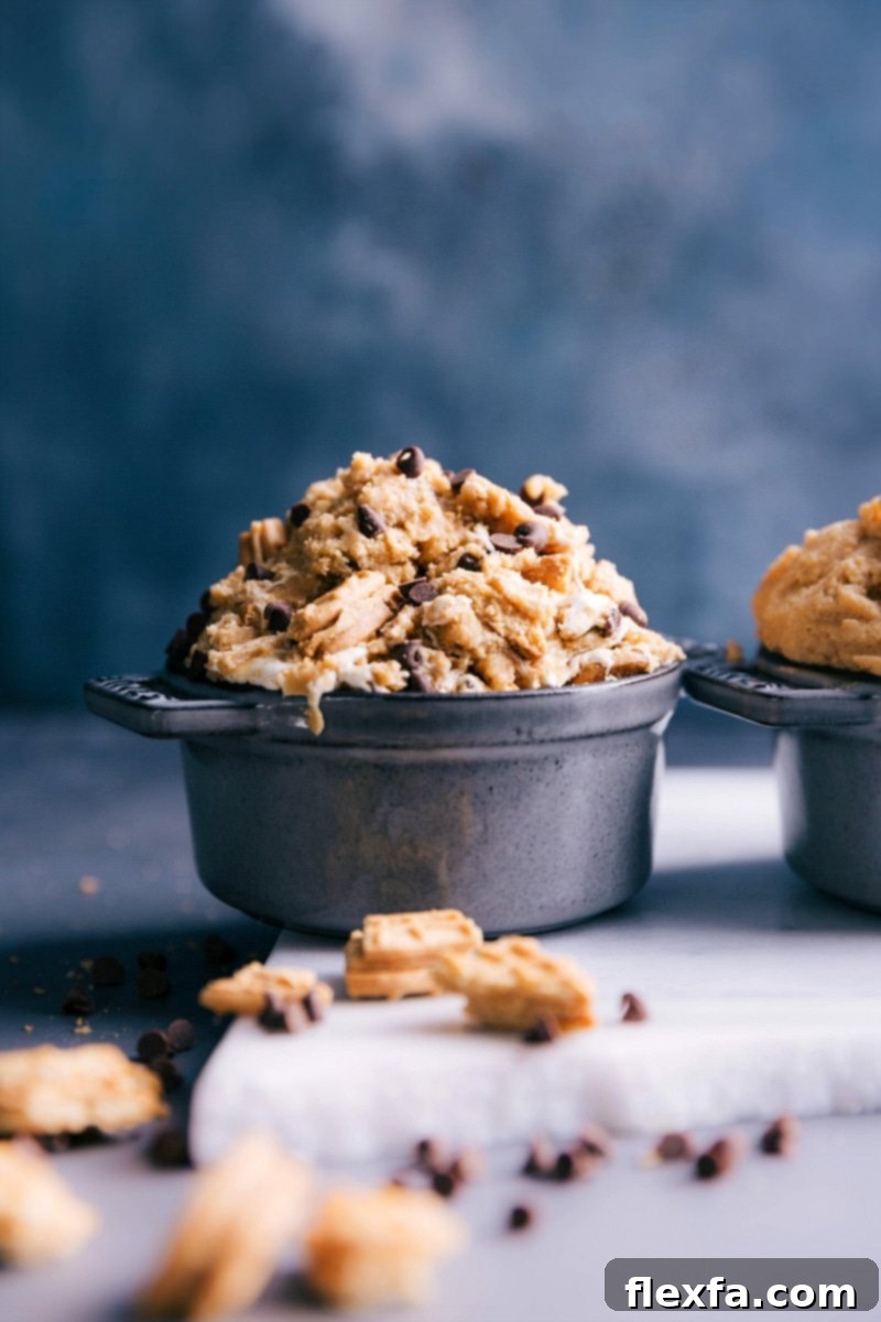 Edible peanut butter cookie dough in a bowl, delicious and ready to be enjoyed with a spoon.