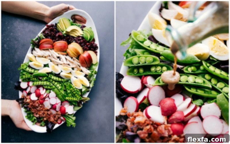 Cobb Salad Platter Drizzled with Creamy Balsamic Dressing A platter of cobb salad, being generously dressed with creamy balsamic dressing.