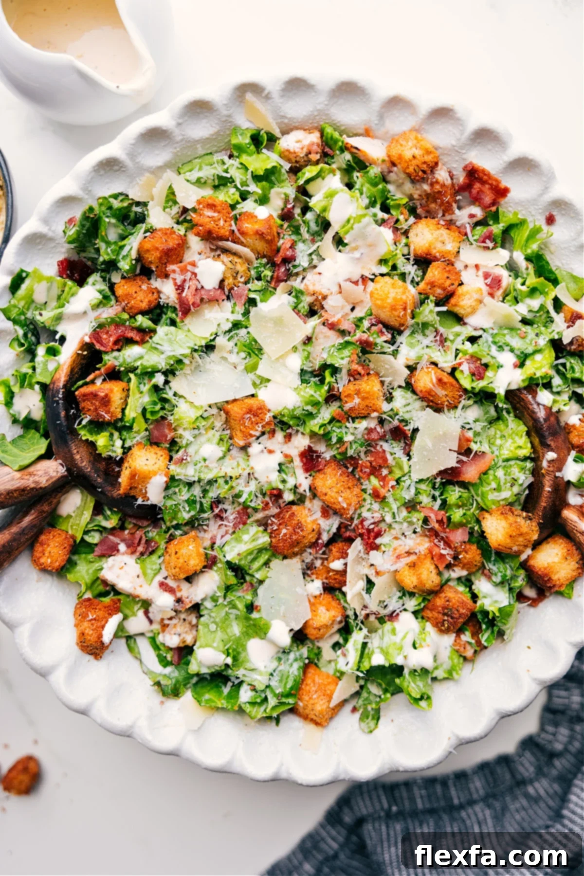 A beautifully presented Caesar Salad in a rustic bowl, perfectly dressed with croutons and Parmesan, ready to be enjoyed.