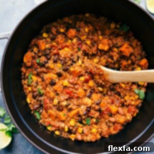 The delicious, warm, and hearty finished Quinoa Chili in a pot, garnished with fresh cilantro, ready to be enjoyed.