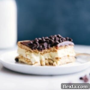 A delicious slice of eclair cake with a bite taken out, revealing its creamy center.
