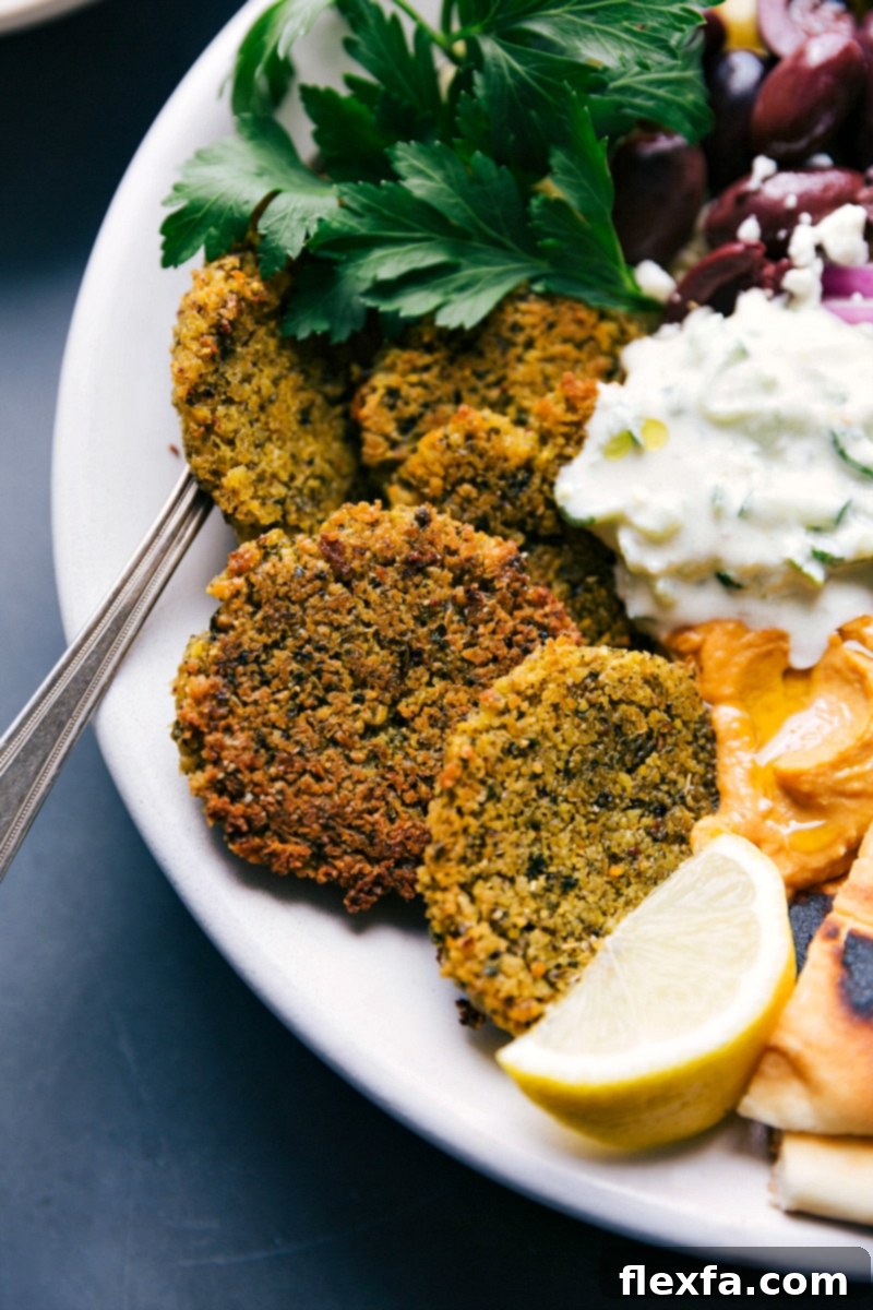 The completed meal with tzatziki sauce, and finished side dishes, ready to be enjoyed.