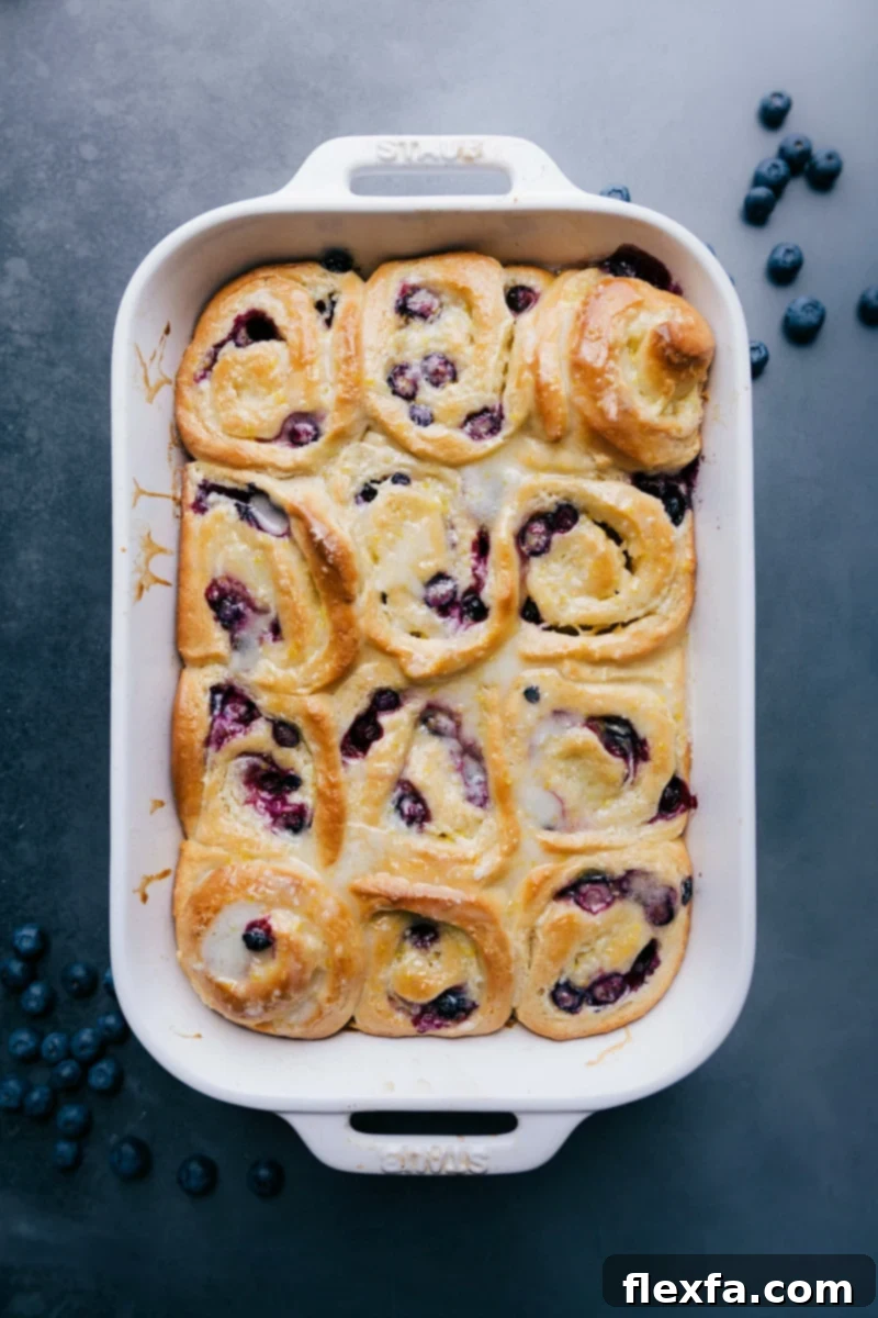Scrumptious lemon-blueberry sweet rolls, a delectable pastry treat ready to be enjoyed.