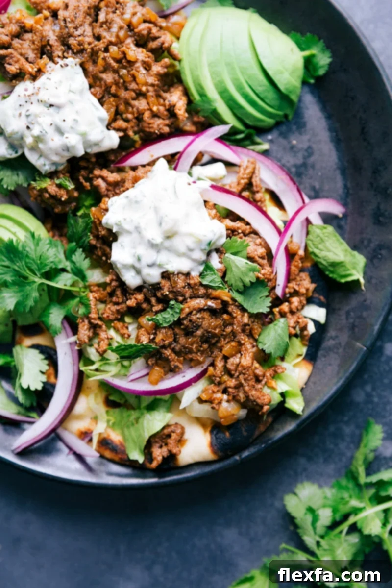 Ground Beef Naan Tacos - Flavorful and Satisfying Ground beef naan tacos with all the toppings, a delicious meal with complimentary flavors ready to be enjoyed.