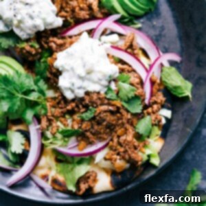 Ground Beef Naan Tacos Image Ground beef naan tacos with all the toppings, a delicious meal with complimentary flavors ready to be enjoyed.