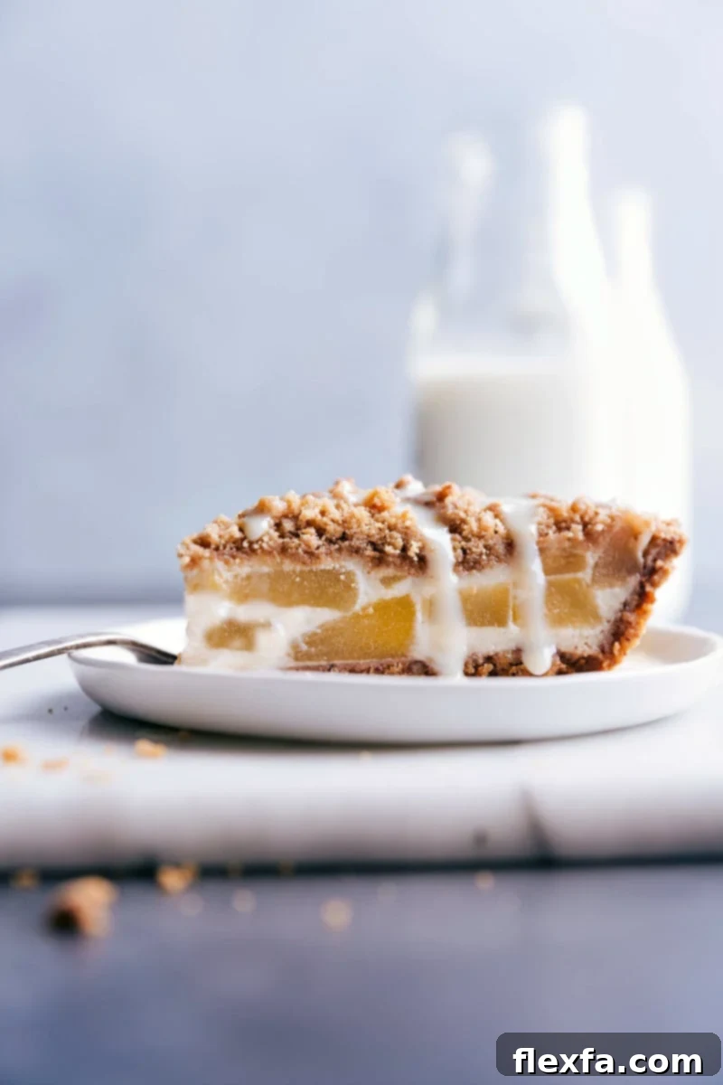 A beautifully baked Apple Streusel Pie with a golden streusel topping and a rich pecan crust, ready to be served.