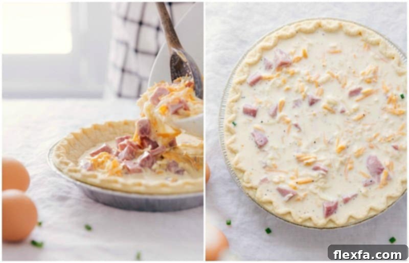 Carefully pouring the creamy egg, ham, and cheese mixture into the pre-baked pie crust on a baking sheet, ensuring an even fill.