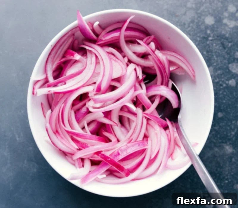 Bowl of Pickled Onions for Taco Topping Pickled onions in a bowl, ready to be used as a topping.