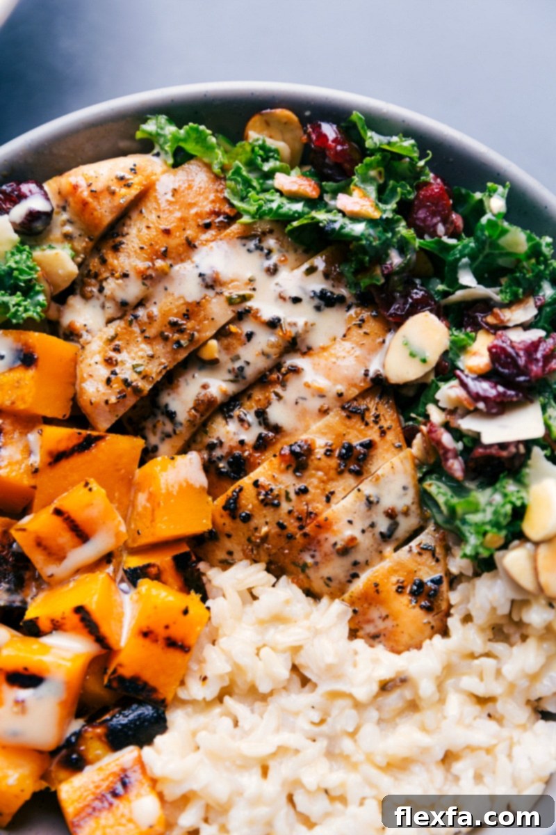 Up-close overhead image of the finished Harvest Bowl, generously drizzled with the sweet honey-Dijon dressing, showcasing all its components beautifully.