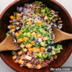 The broccoli salad in a bowl ready to be tossed together with dressing.