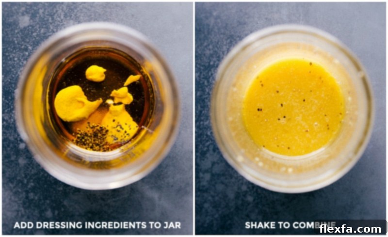 A mason jar filled with a homemade apple cider vinaigrette dressing, ready to be shaken and poured over a fresh salad.