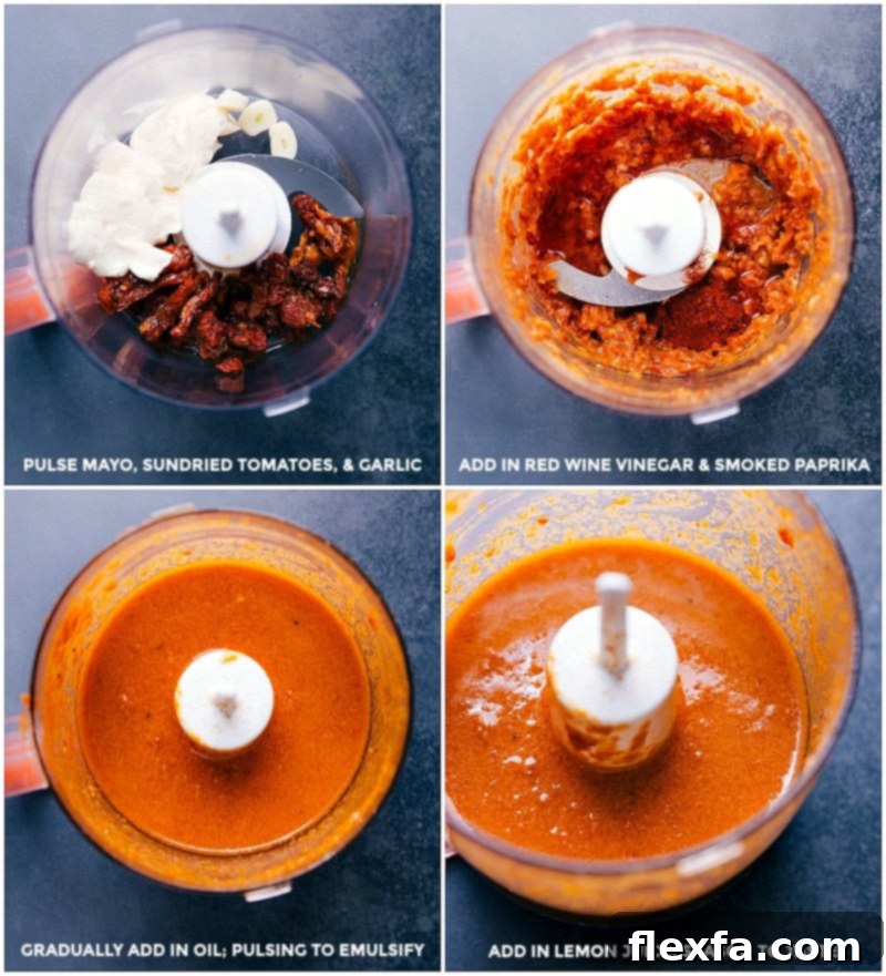 Sun-dried tomato sauce being made in a food processor, showing its creamy texture.