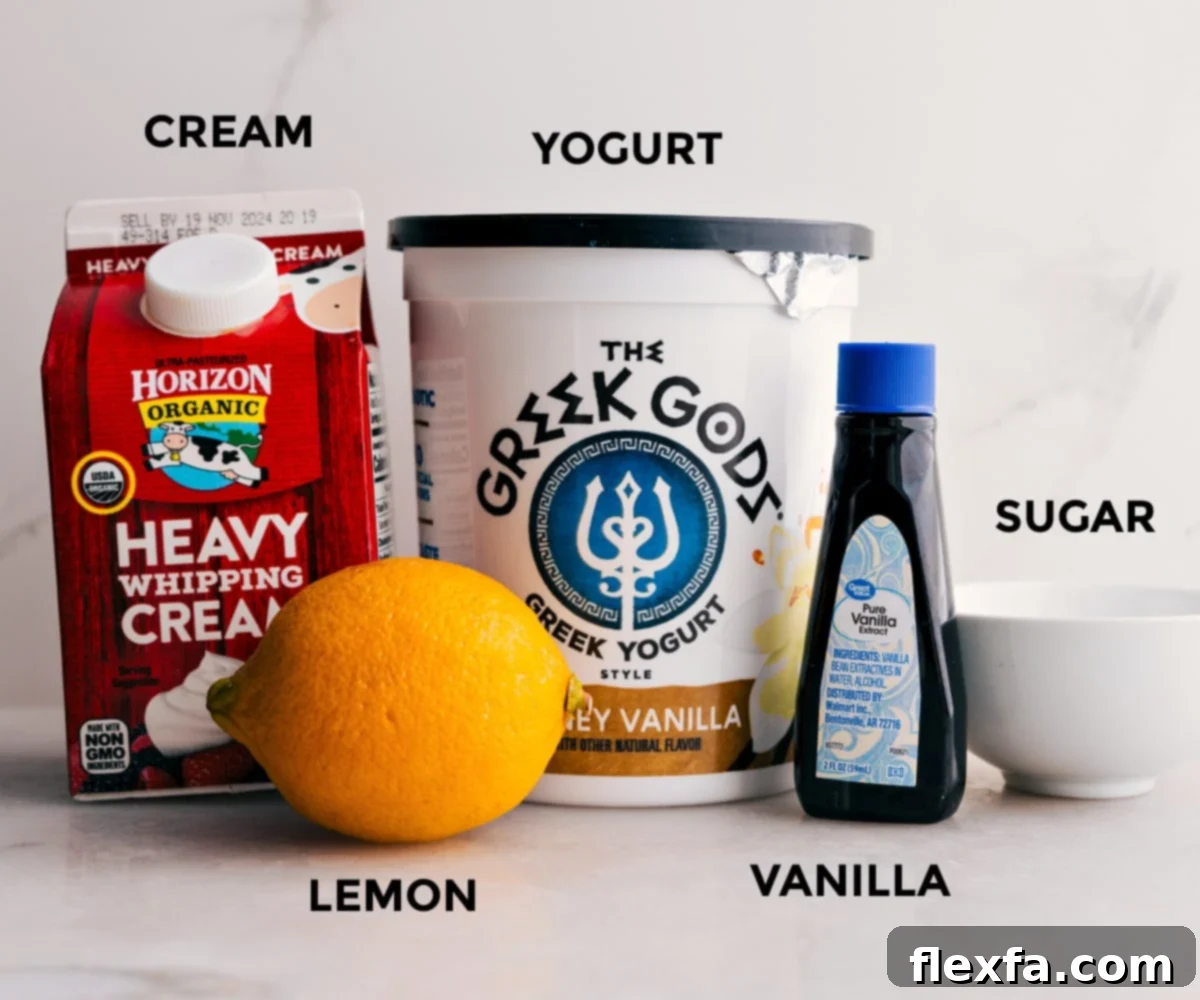 Ingredients for the luscious whipped cream dressing, including Greek yogurt, vanilla extract, powdered sugar, lemon zest and juice, and heavy cream, being prepped in a bowl.
