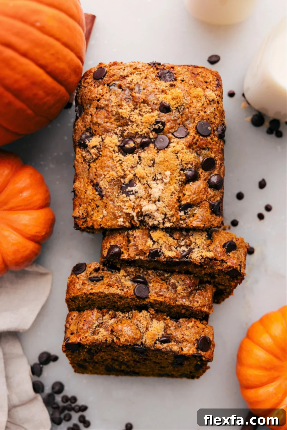 Healthy Pumpkin Bread Slices A loaf of moist pumpkin bread with a rich orange color, sliced and ready to enjoy.