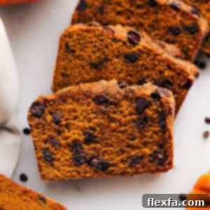 Moist and flavorful healthy pumpkin bread slices, packed with nutritious ingredients and fall spices.