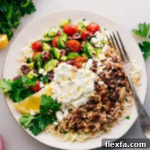 A finished Greek Ground Turkey Bowl with all toppings, ready to serve.
