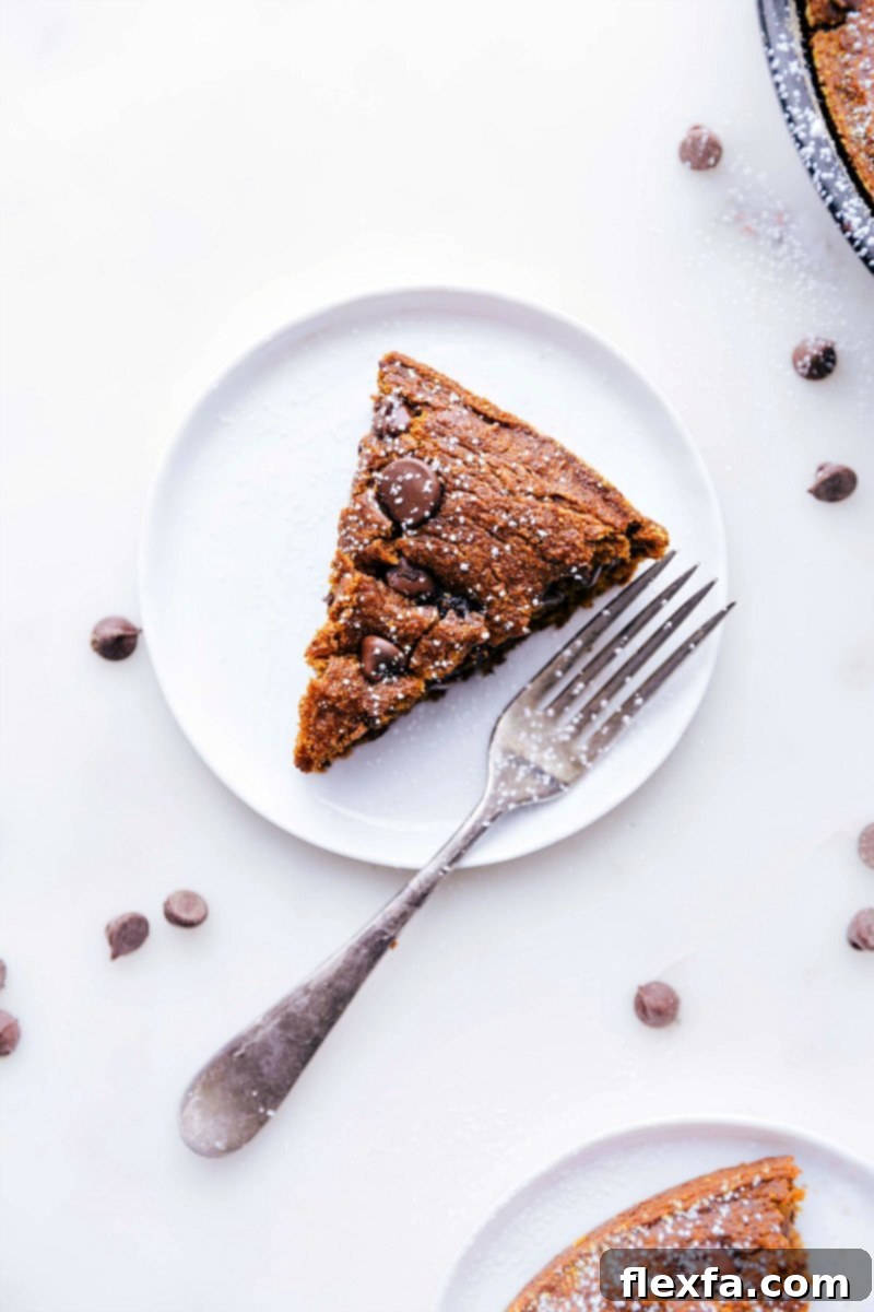 Cozy Gluten-Free Pumpkin Spice Cake 2 A perfectly cut slice of gluten-free pumpkin cake, showcasing its moist texture and inviting spices, ready for serving.