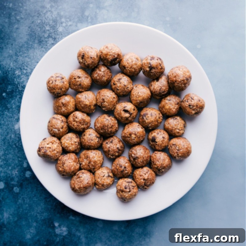 A perfectly arranged plate filled with freshly made Oatmeal Energy Balls, showcasing their round shape and inviting appearance.