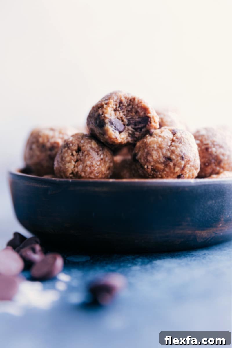 A close-up view of a bowl generously filled with Oatmeal Energy Balls, emphasizing their healthy ingredients and satisfying texture.
