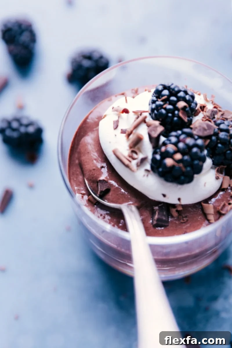 Chocolate Chia Seed Pudding, garnished with fresh berries and a sprinkle of cocoa.