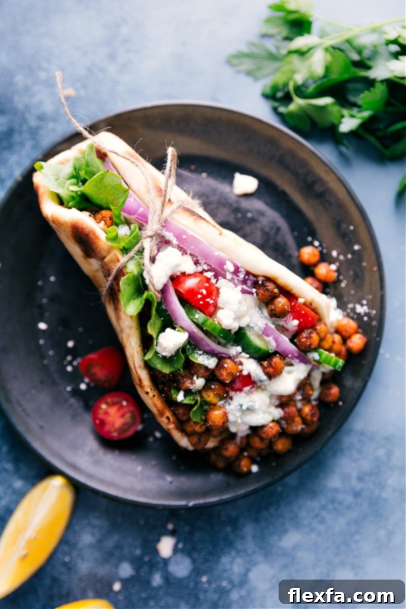 Overhead view of a perfectly filled pita bread for Vegetarian Gyros, ready to be enjoyed.