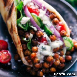 Vegetarian Gyros with seasoned chickpeas, fresh veggies, and Tzatziki.