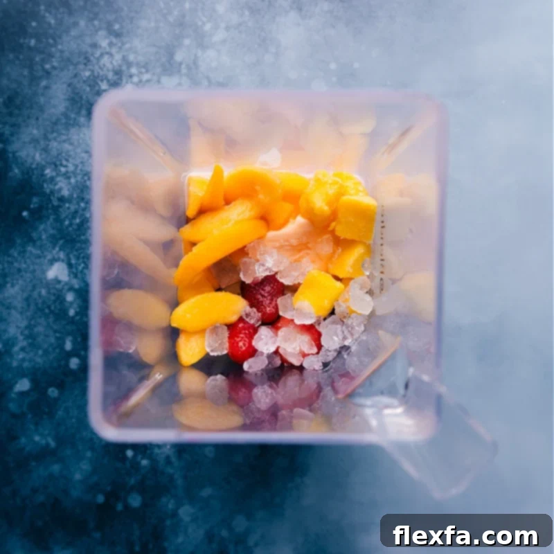 Preparing Your Perfect Caribbean Passion Smoothie - Ingredients in Blender All Caribbean Passion Smoothie ingredients layered in a high-powered blender, ready to be processed for blending.