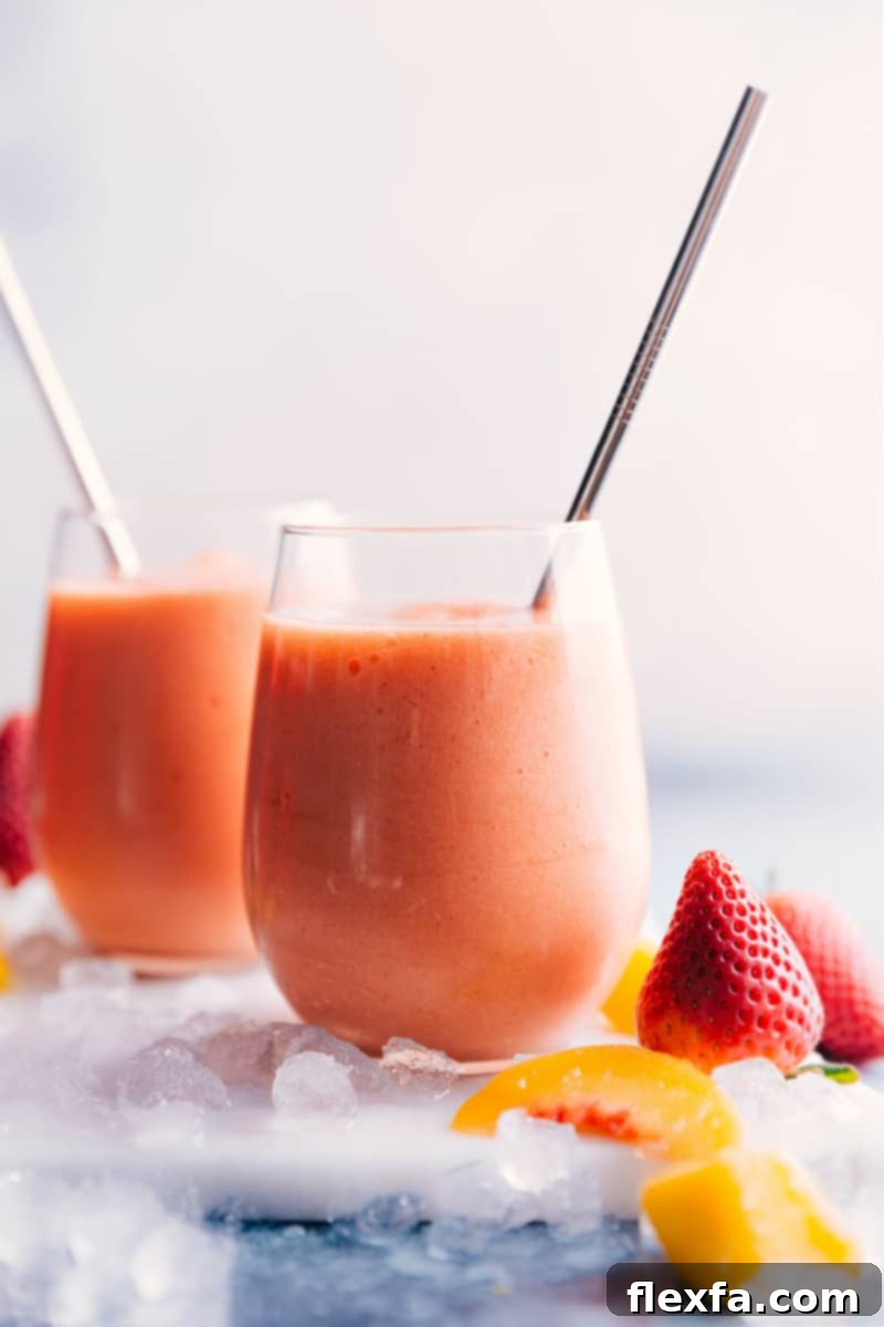 Refreshing Caribbean Passion Smoothies Ready to Serve Two freshly prepared Caribbean Passion Smoothies in glasses, adorned with colorful straws, on a bright background.