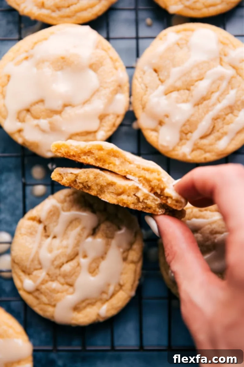 A batch of freshly glazed maple cookies cooling on a wire rack, showcasing their irresistible appeal.