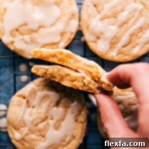 A close-up shot of a perfectly baked maple cookie with a sweet, glossy glaze.