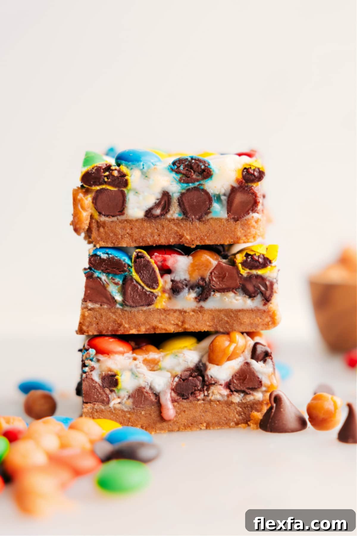 The Best Dessert: Ultimate Magic Cookie Bars Recipe Stacked Magic Cookie Bars showing their rich layers of chocolate, caramel, and oats.