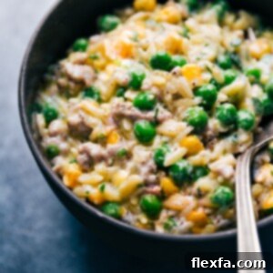 Creamy Pesto Orzo in a serving bowl with a spoon