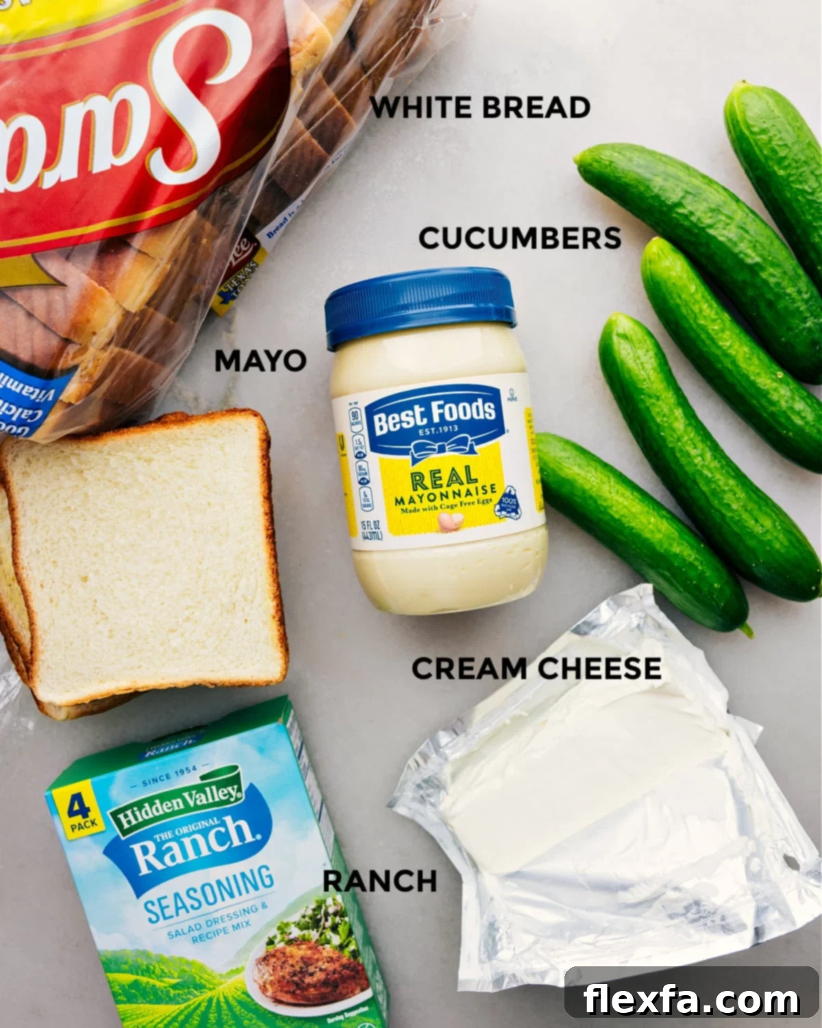 All the essential ingredients for making the best cucumber sandwiches, neatly prepped and laid out for easy assembly.