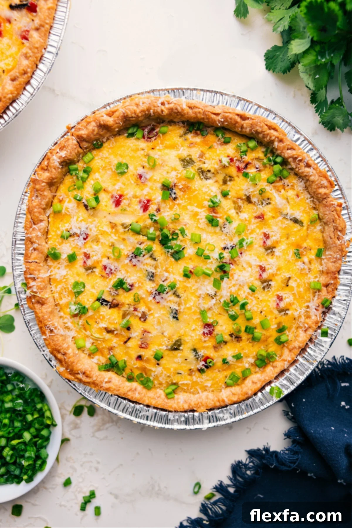 Veggie Quiche fresh out of the oven with green onions.
