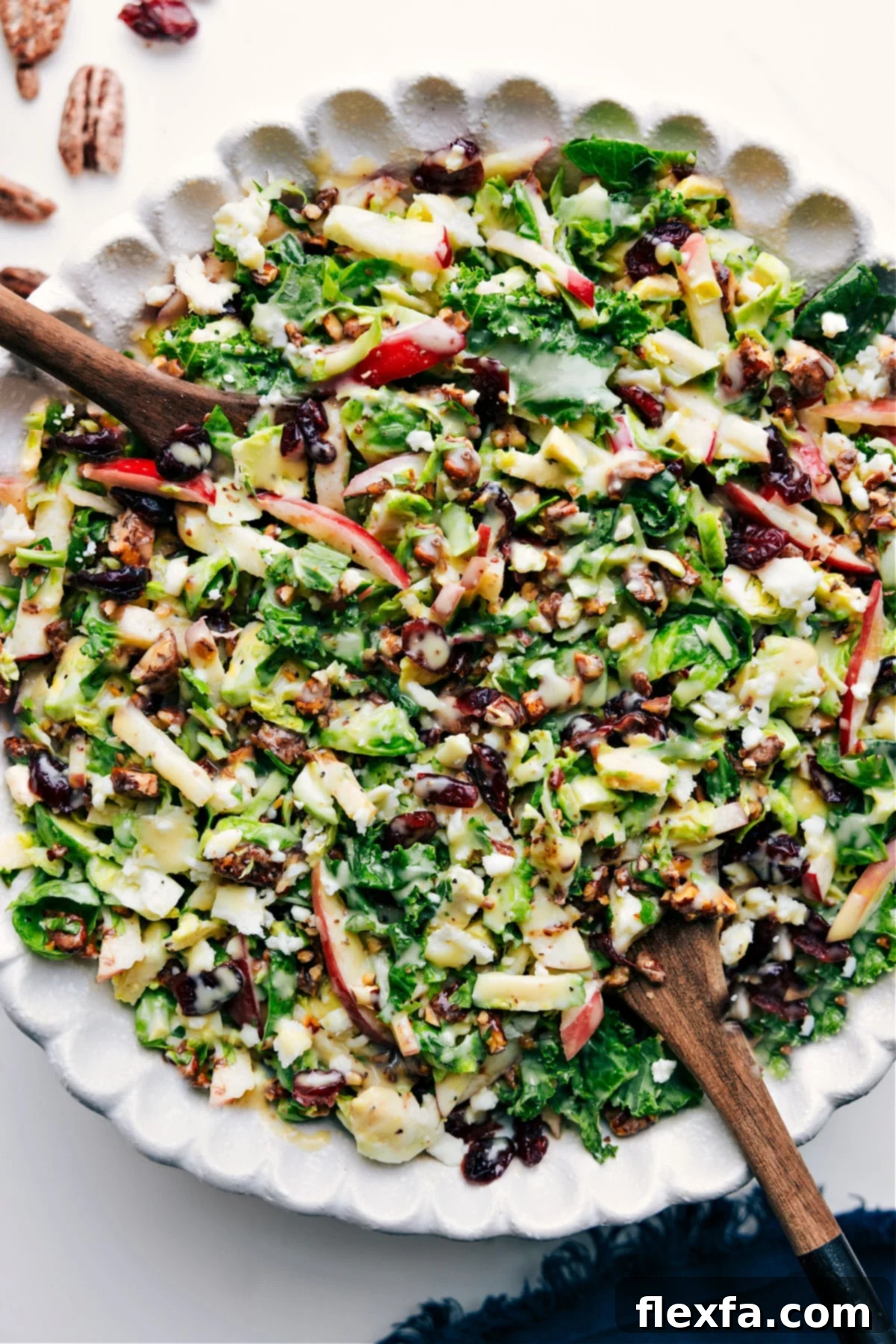 Brussel Sprout Salad Recipe in a bowl, tossed with dressing and ready to eat.