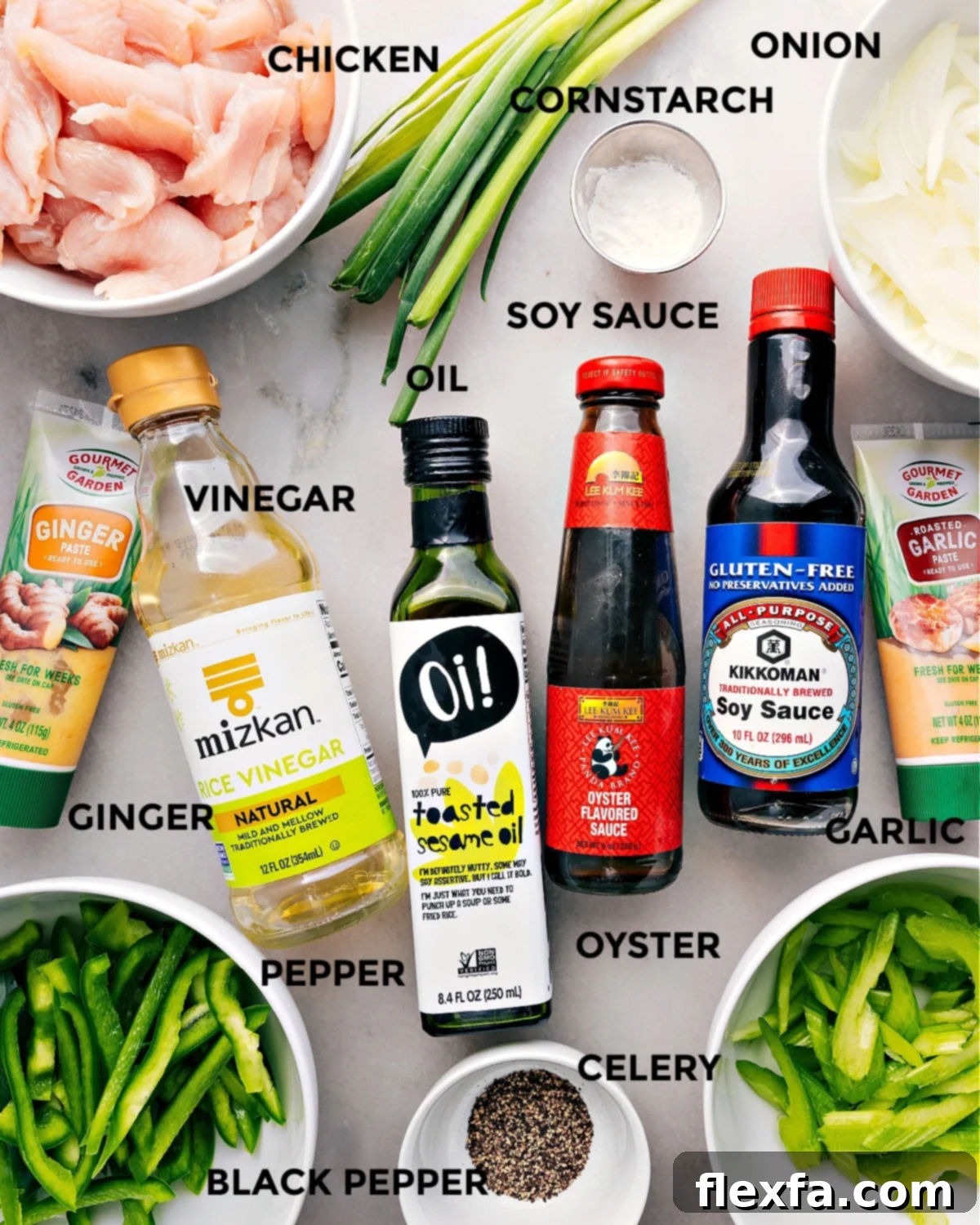 All ingredients prepped for Black Pepper Chicken recipe: chicken, cornstarch, onion, soy sauce, oil, vinegar, garlic, oyster sauce, rice vinegar, ginger, pepper, celery.