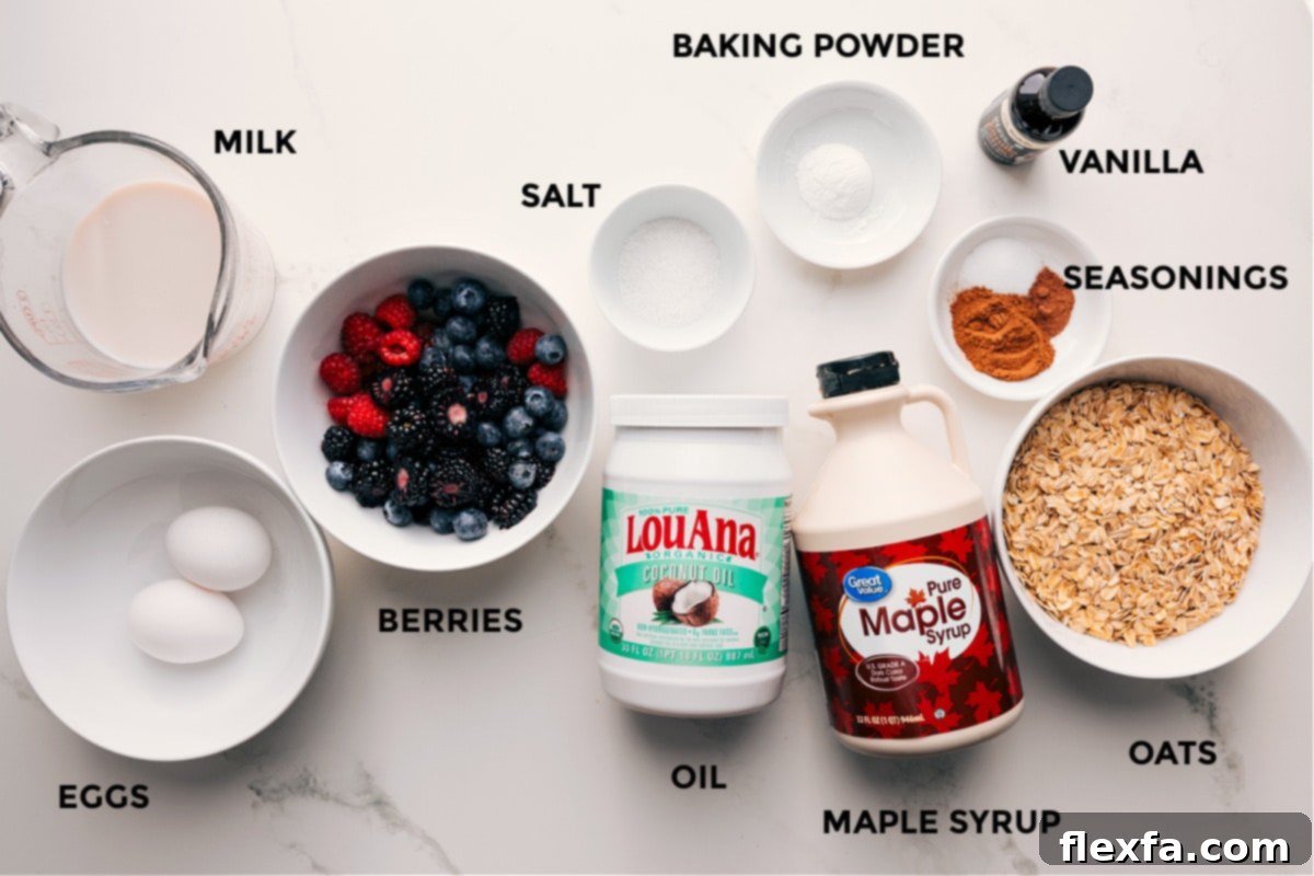 Ingredients for berry oatmeal bake, including milk, eggs, berries, and oats.