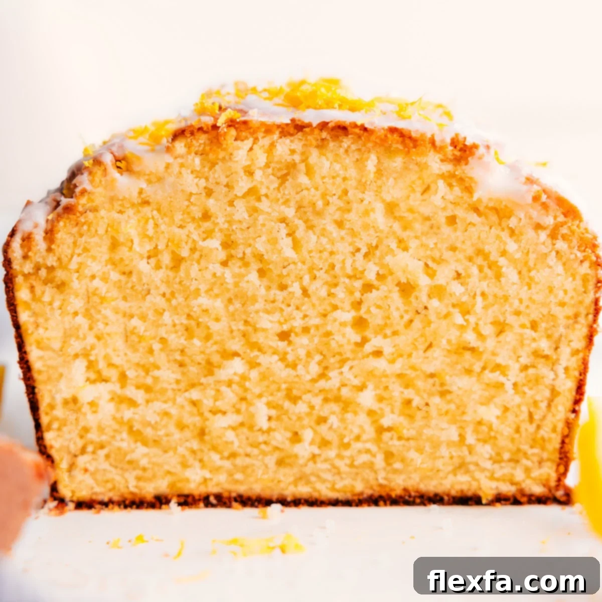 Lemon bread recipe freshly cut open, showing the soft texture inside.