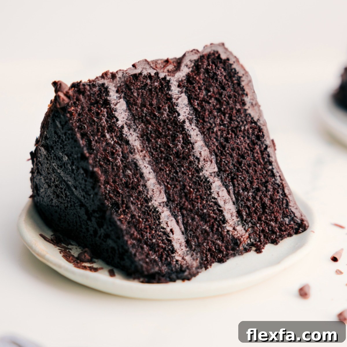 A slice of decadent chocolate cake on a plate.