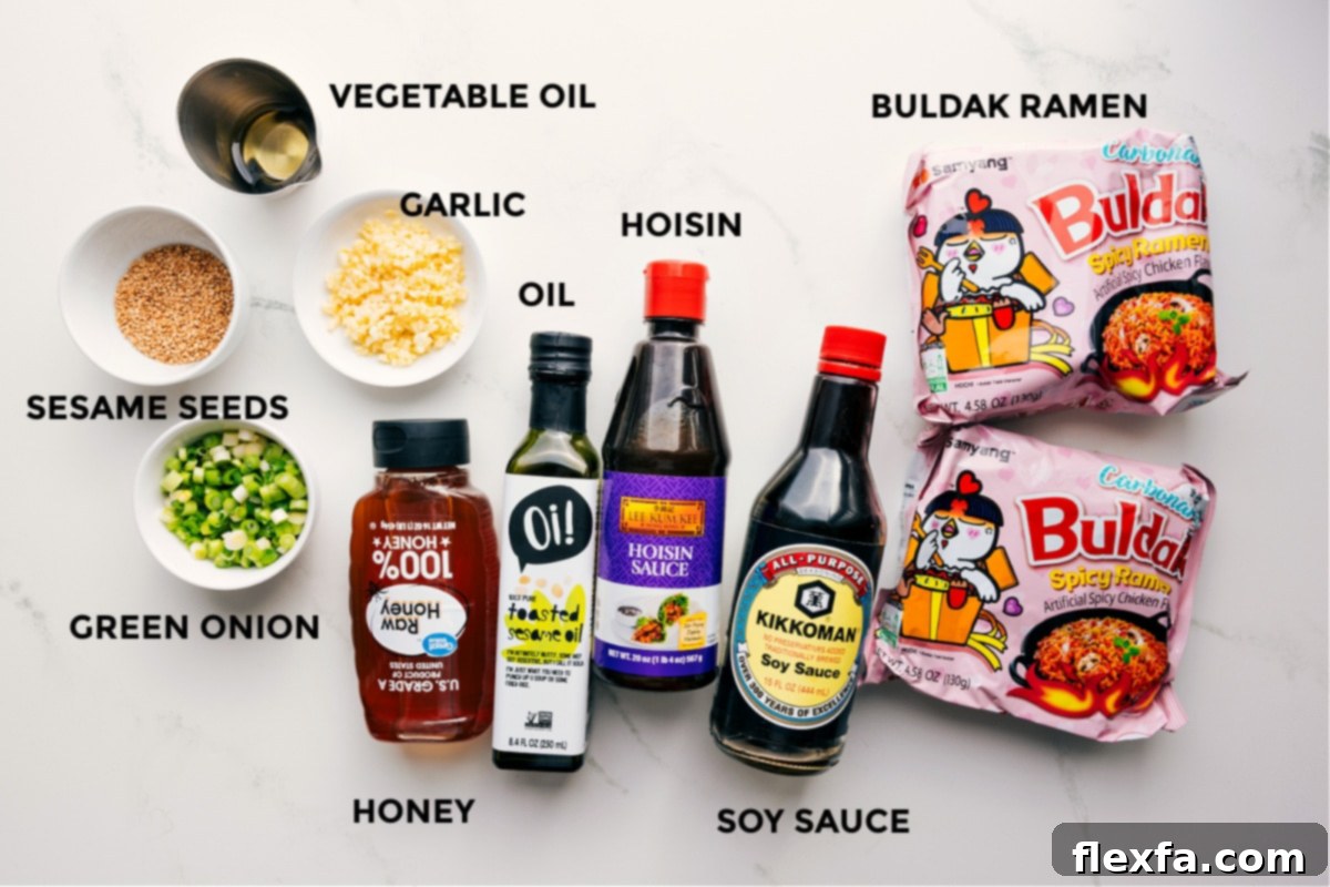 Ingredients for Asian Noodle Recipe including sesame seeds, green onion, garlic, honey, sesame oil, hoisin, soy sauce, and ramen.
