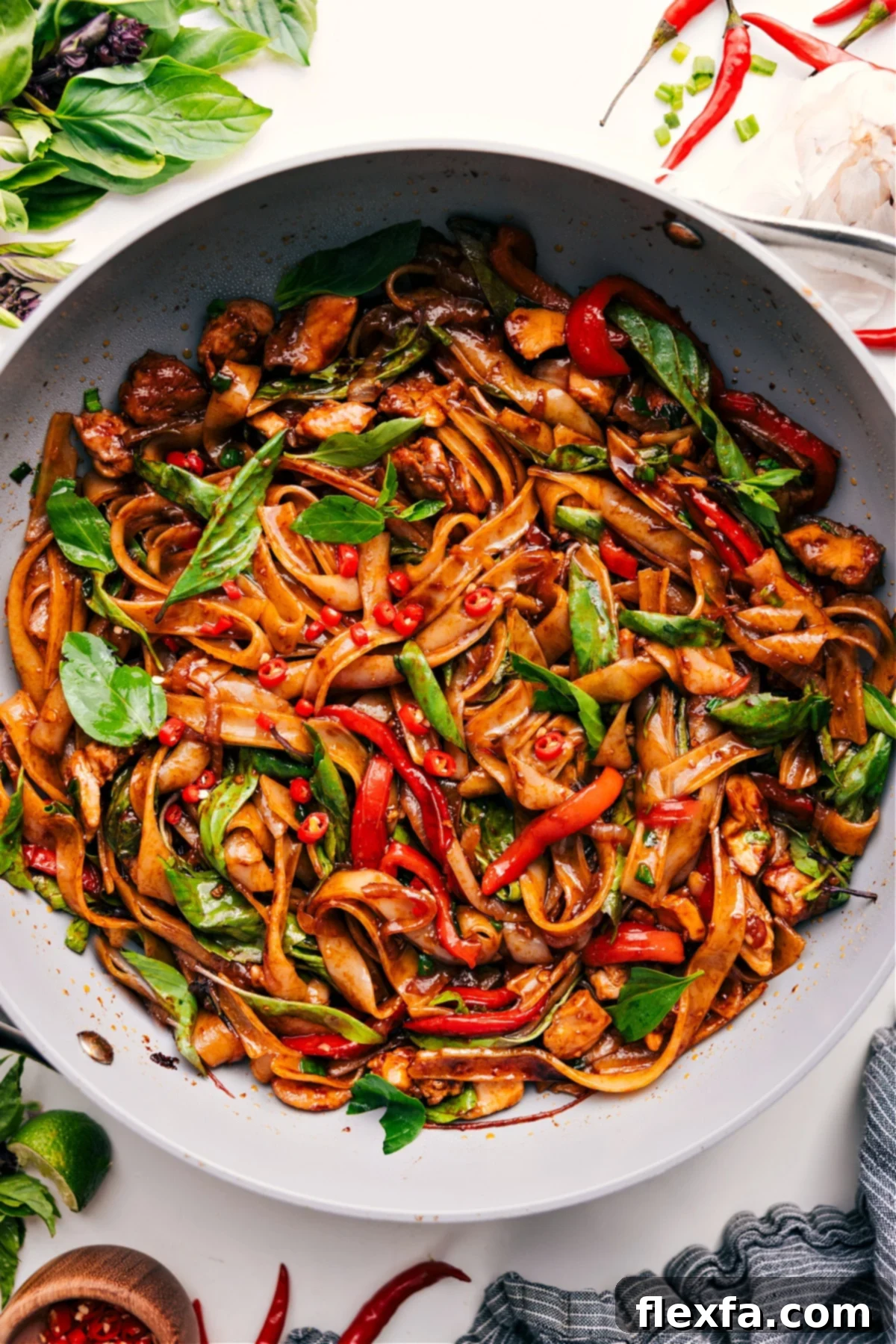 Delicious Thai Drunken Noodles with fresh basil.