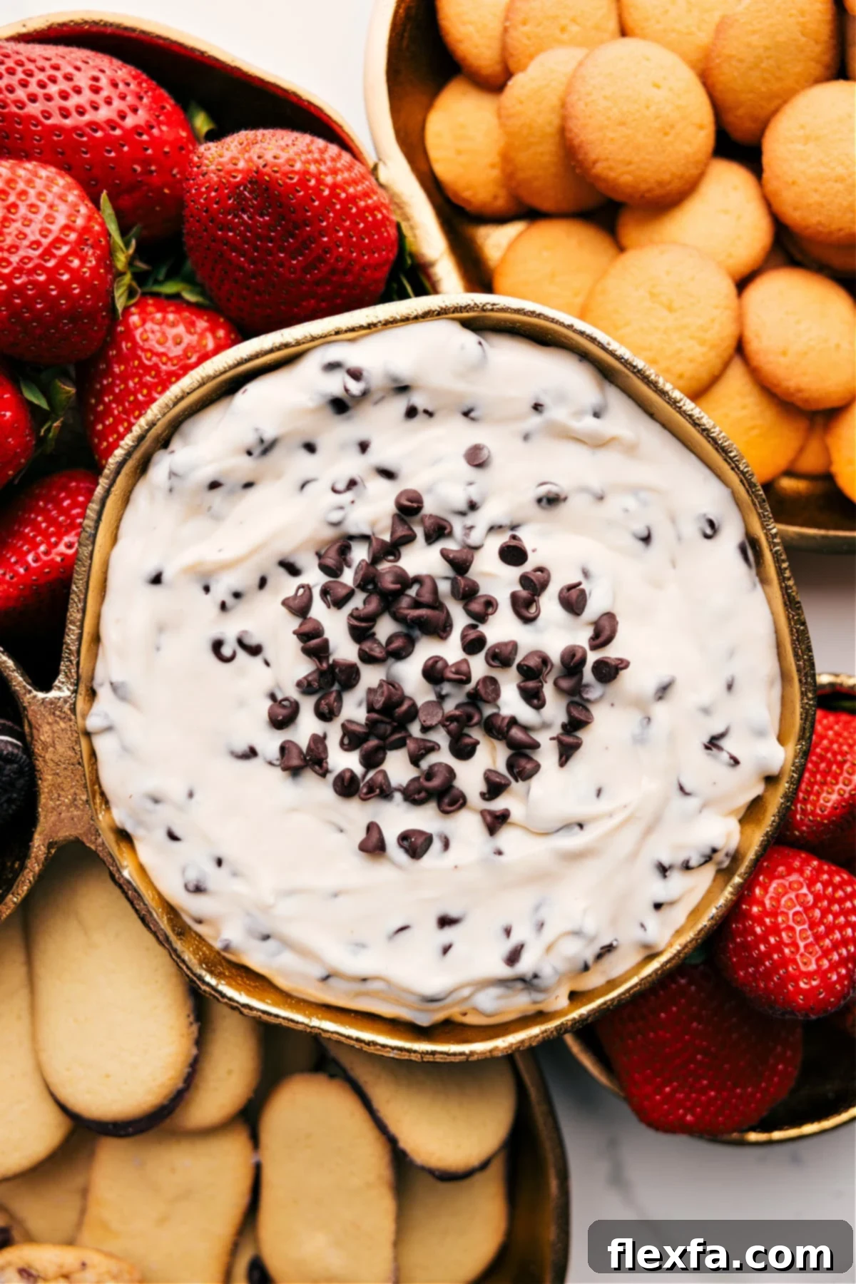Delicious Chocolate Chip Dip served with strawberries and cookies