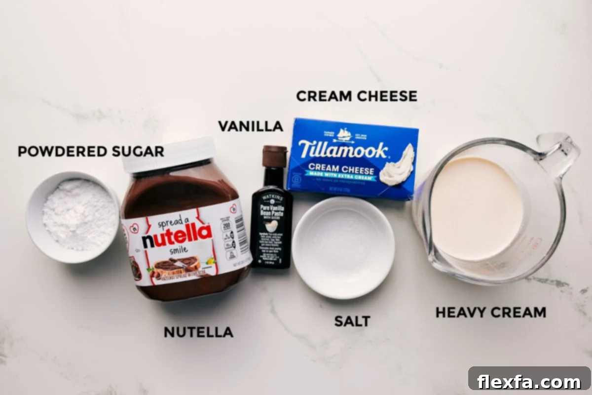 All the ingredients in this recipe prepped out for easy assembly including the powdered sugar, Nutella, vanilla, cream cheese, salt, and heavy cream.