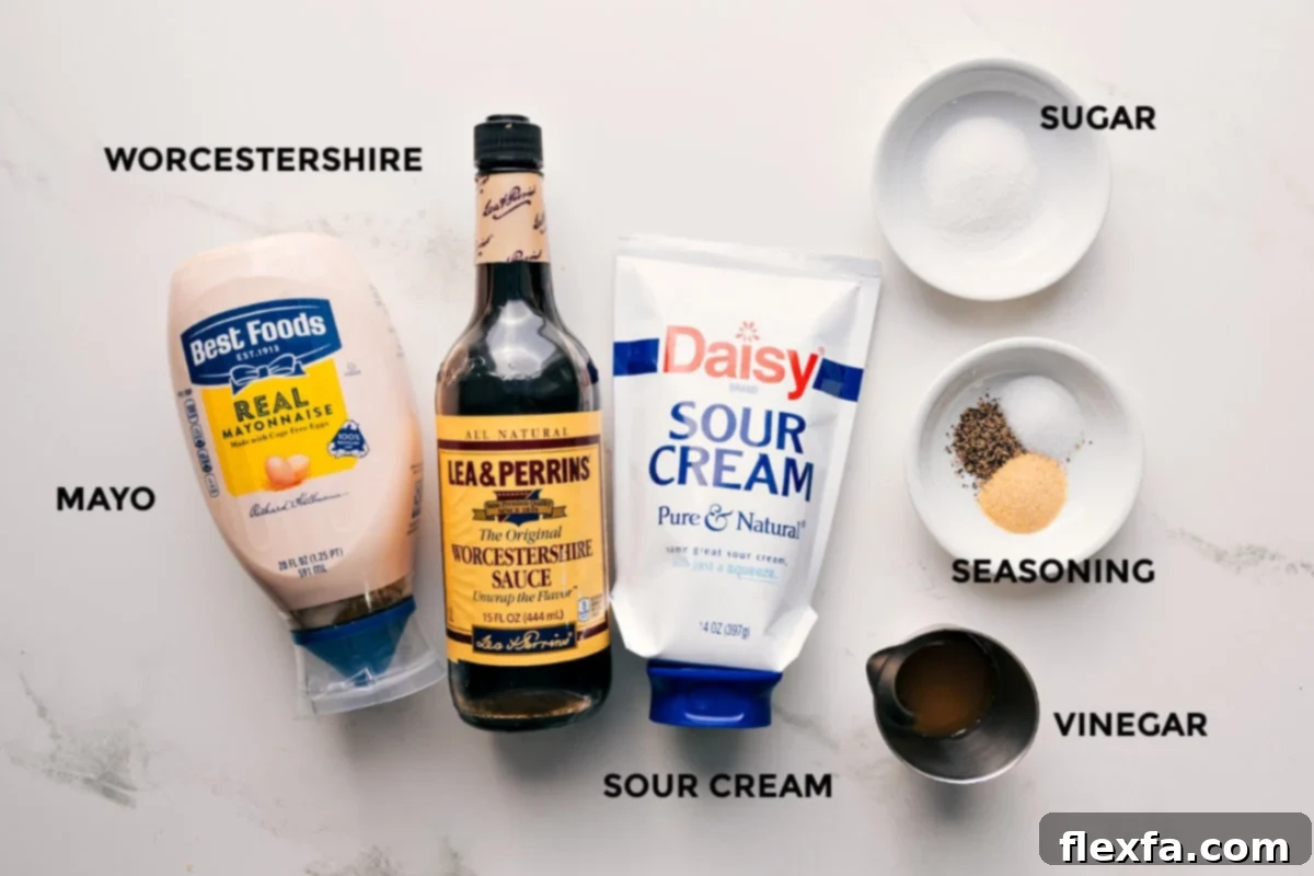 All the dressing ingredients for the 7 Layer Salad laid out: mayonnaise, sour cream, apple cider vinegar, sugar, Worcestershire sauce, garlic powder, salt, and pepper, ready to be whisked into a smooth, creamy concoction.