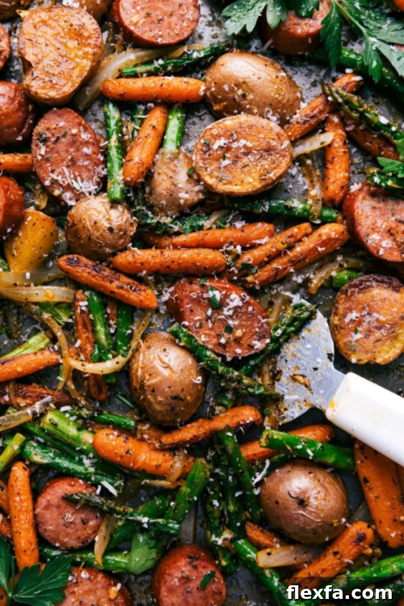 Sheet Pan Sausage and Potatoes with roasted asparagus and carrots.