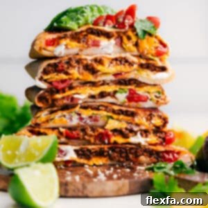 The finished Crunchwrap Supreme recipe, cut in half and stacked for serving.