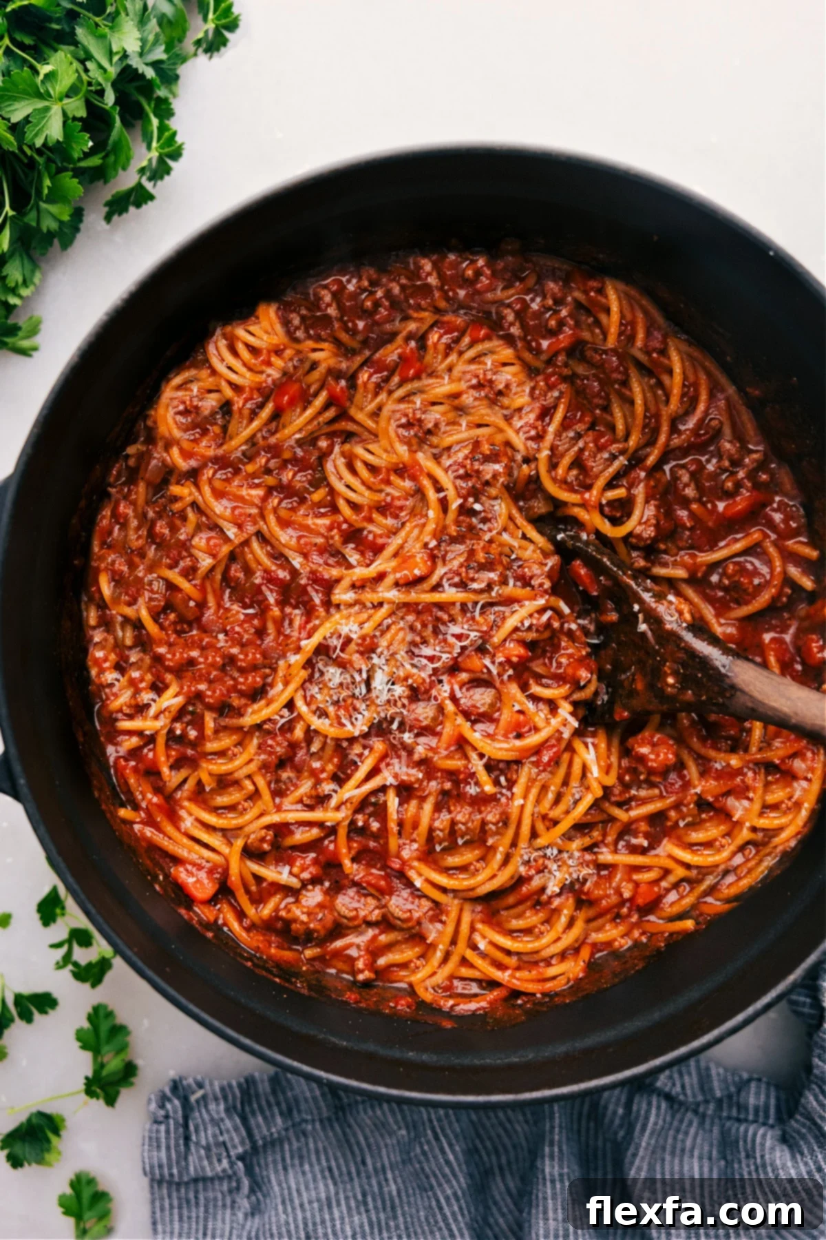 A large pot filled with freshly cooked One Pot Spaghetti, mixed with a rich meat sauce and ready to be served.
