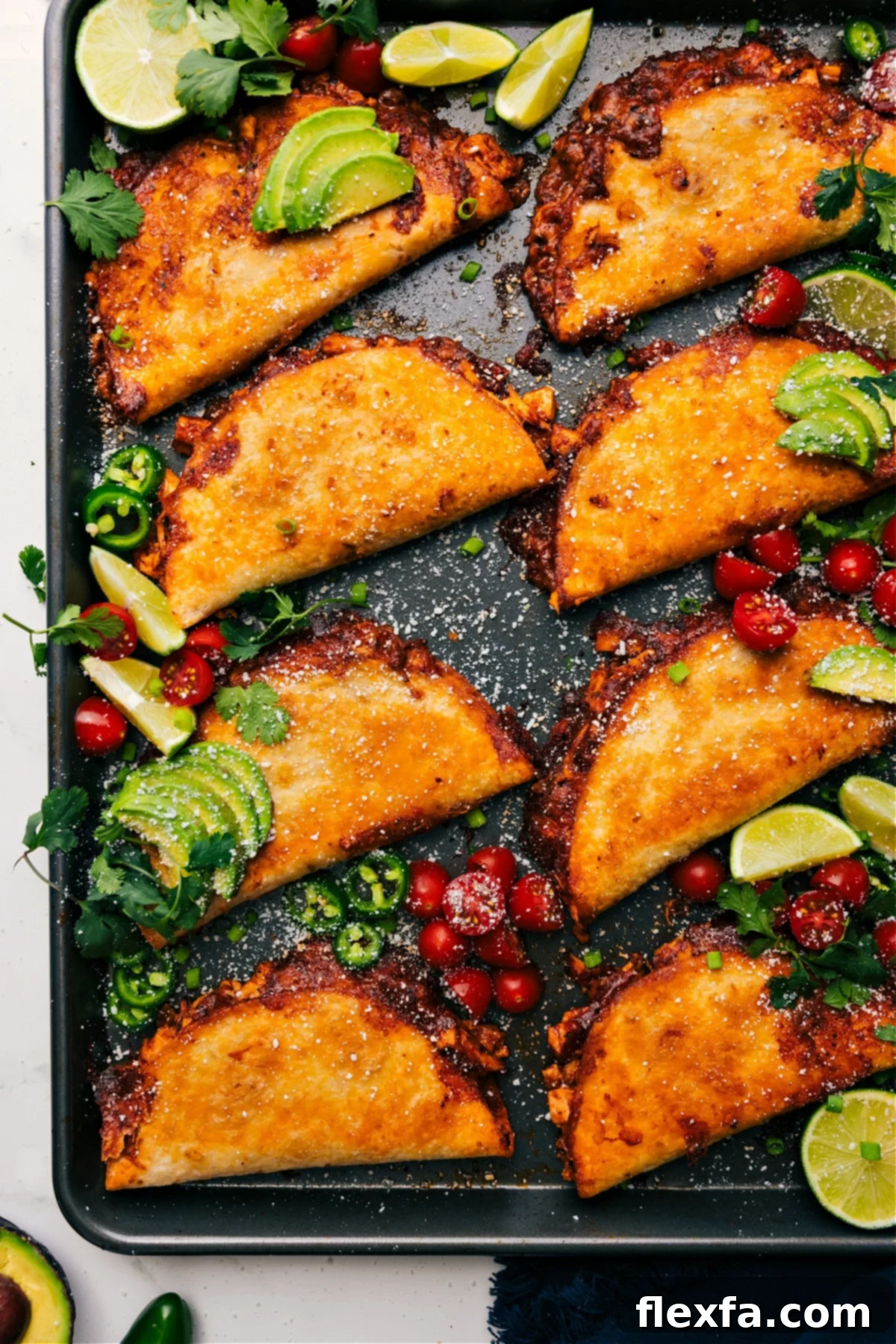 Crispy chicken tacos bursting with flavorful filling and topped with a creamy chili-lime sauce.