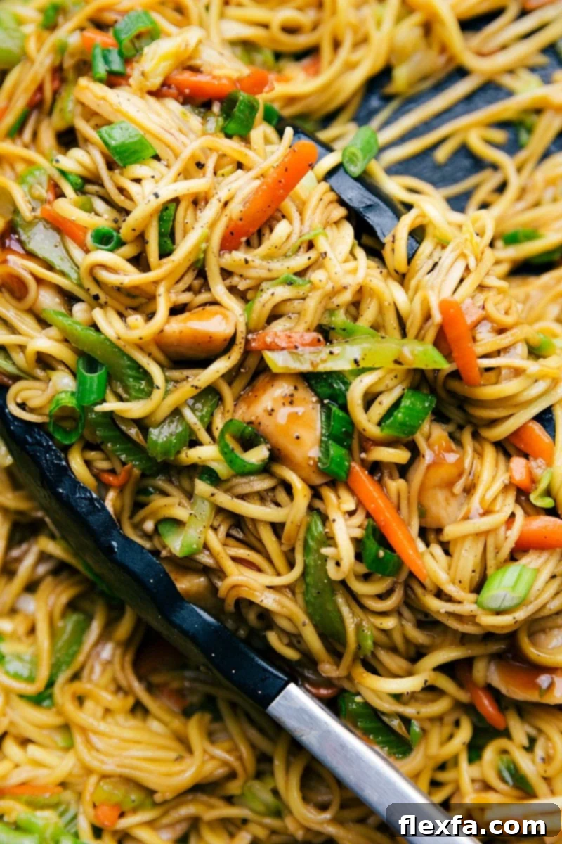 Quick 30-minute chicken chow mein in a skillet, packed with fresh vegetables and perfectly seasoned noodles.